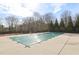 An outdoor pool closed for the season with a safety cover at 3750 Thackary Dr, Powder Springs, GA 30127