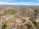 Aerial view of a +/- 2.18 acre lot featuring a charming single-Gathering home surrounded by beautiful fall foliage at 6045 Mockingbird Rd, Cumming, GA 30028