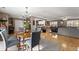 Open floor plan integrating dining area, kitchen, and living room; perfect for modern living at 6045 Mockingbird Rd, Cumming, GA 30028