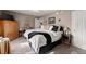 Spacious bedroom with carpet, a ceiling fan, and a large bed with modern furniture at 6045 Mockingbird Rd, Cumming, GA 30028