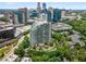 Stunning aerial view of a high-rise condo surrounded by lush greenery and the city skyline at 700 Park Regency Ne Pl # 1407, Atlanta, GA 30326