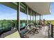 Spacious balcony with seating and panoramic views of lush greenery at 700 Park Regency Ne Pl # 1407, Atlanta, GA 30326