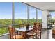 Charming dining area showcasing large windows with scenic views, a rustic wooden table, and seating for six at 700 Park Regency Ne Pl # 1407, Atlanta, GA 30326