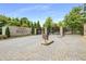 Grand entrance to Park Regency with stone pillars and wrought iron gates, showcasing the community's prestige at 700 Park Regency Ne Pl # 1407, Atlanta, GA 30326