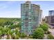Upscale high-rise featuring balconies with city views and a swimming pool with manicured green space in Buckhead at 700 Park Regency Ne Pl # 1407, Atlanta, GA 30326