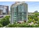 Stunning high-rise building with modern architecture, floor-to-ceiling windows, and lush greenery in Buckhead Atlanta at 700 Park Regency Ne Pl # 1407, Atlanta, GA 30326