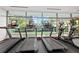 Well-equipped fitness center featuring treadmills and elliptical machines with large windows overlooking greenery at 700 Park Regency Ne Pl # 1407, Atlanta, GA 30326
