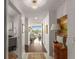 Bright hallway featuring hardwood floors, elegant lighting, and seamless transition to the living area with a stunning view at 700 Park Regency Ne Pl # 1407, Atlanta, GA 30326