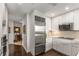 Bright kitchen features stainless steel appliances and white cabinets, offering a sleek and modern design at 700 Park Regency Ne Pl # 1407, Atlanta, GA 30326