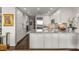 This modern kitchen features stainless appliances, granite counters and pendant lighting at 700 Park Regency Ne Pl # 1407, Atlanta, GA 30326