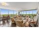 Spacious living room boasts expansive windows offering panoramic views, complemented by stylish furnishings and hardwood floors at 700 Park Regency Ne Pl # 1407, Atlanta, GA 30326