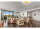 Inviting living room features floor-to-ceiling windows, elegant furnishings, and an open layout with access to balcony views at 700 Park Regency Ne Pl # 1407, Atlanta, GA 30326