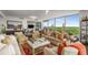 Elegant living room featuring stylish seating, expansive windows, and panoramic views of lush greenery and city skyline at 700 Park Regency Ne Pl # 1407, Atlanta, GA 30326