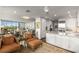 Open-concept living space with modern kitchen, comfortable seating area, and large windows offering natural light and city views at 700 Park Regency Ne Pl # 1407, Atlanta, GA 30326