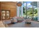 Bright lobby area featuring high ceilings, modern furnishings, and floor to ceiling windows offering beautiful green views at 700 Park Regency Ne Pl # 1407, Atlanta, GA 30326