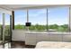 Bright main bedroom with large windows offering panoramic views of the surrounding landscape at 700 Park Regency Ne Pl # 1407, Atlanta, GA 30326