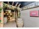 Rustic wine cellar with decorative barrels, grape vines, and a painted mural of wine bottles and Chianti Classico at 700 Park Regency Ne Pl # 1407, Atlanta, GA 30326