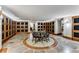 Wine room featuring display cabinets and a round table in the center on a custom tiled floor pattern at 700 Park Regency Ne Pl # 1407, Atlanta, GA 30326