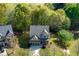 Aerial view of the home showing front yard, driveway and roof at 2155 Mindy Ln, Cumming, GA 30041