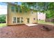 Home backyard with patio, firepit and trees at 2155 Mindy Ln, Cumming, GA 30041