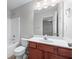 Bathroom with white sink, vanity, toilet, shower and tub at 2155 Mindy Ln, Cumming, GA 30041
