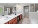Elegant primary bathroom featuring dual sinks, a glass shower, and ample counter space at 2155 Mindy Ln, Cumming, GA 30041