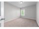 Carpeted bedroom with window allowing natural light at 2155 Mindy Ln, Cumming, GA 30041