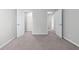 Bedroom features neutral walls, plush carpet, closet and ensuite bathroom at 2155 Mindy Ln, Cumming, GA 30041