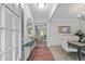 Elegant foyer with wood floors, decorative mirror, and dining room view, creating a welcoming entrance at 2155 Mindy Ln, Cumming, GA 30041