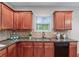 Well-organized kitchen featuring sleek granite countertops and stainless steel dishwasher at 2155 Mindy Ln, Cumming, GA 30041