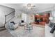 Open living room with staircase, stylish furniture, and view of kitchen, ideal for modern living at 2155 Mindy Ln, Cumming, GA 30041
