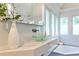 Modern bathroom vanity featuring designer glass bowl sink, quartz countertop and luxurious finishes at 2682 Boulder Creek Ne Dr, Roswell, GA 30075