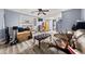 Spacious basement with wood-look flooring, storage shelves, and a comfortable seating area at 411 Hollis Cir, Dallas, GA 30157