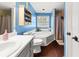 Bright bathroom with a soaking tub and lots of storage space at 411 Hollis Cir, Dallas, GA 30157