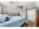 Bedroom featuring a four-poster bed, neutral carpet, and ample closet space at 411 Hollis Cir, Dallas, GA 30157