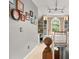 Hallway with charming decor, built-in shelves and a sunlit window seat with backyard view at 411 Hollis Cir, Dallas, GA 30157