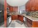 Kitchen with stainless steel appliances, granite countertops and mosaic backsplash, a chef's dream at 411 Hollis Cir, Dallas, GA 30157