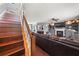 Open-concept living room boasts hardwood floors, fireplace, built-in shelves, and staircase at 411 Hollis Cir, Dallas, GA 30157