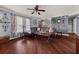 Spacious living room features hardwood floors, stylish decor, and a staircase leading upstairs at 411 Hollis Cir, Dallas, GA 30157