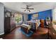 Comfortable main bedroom with hardwood floors and stylish furnishings at 411 Hollis Cir, Dallas, GA 30157