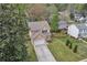 Charming two-story home with well-manicured lawn, and a long concrete driveway at 4567 Hickory Forest Nw Dr, Acworth, GA 30102