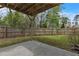 Backyard features a patio, lush green grass, and a tall wood fence at 4567 Hickory Forest Nw Dr, Acworth, GA 30102