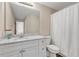 Bathroom with white vanity, granite countertops, and shower with white curtain at 4567 Hickory Forest Nw Dr, Acworth, GA 30102