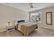 Bedroom featuring a full bed with gray and brown accents, a mirror and a side table at 4567 Hickory Forest Nw Dr, Acworth, GA 30102