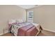 Bedroom featuring a full-size bed and a light-filled window at 4567 Hickory Forest Nw Dr, Acworth, GA 30102