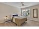 Inviting bedroom boasts a queen-size bed, ceiling fan, and ample natural light at 4567 Hickory Forest Nw Dr, Acworth, GA 30102