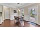 Dining area featuring a modern table setting and natural light from the backyard door and window at 4567 Hickory Forest Nw Dr, Acworth, GA 30102