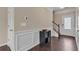 Entryway with hardwood floors, wainscotting and stairway at 4567 Hickory Forest Nw Dr, Acworth, GA 30102