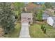 Aerial view of a two-story home with a well-maintained lawn and cozy front porch at 4567 Hickory Forest Nw Dr, Acworth, GA 30102