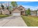 Charming two-story home featuring a two-car garage, well-manicured lawn, and inviting front porch at 4567 Hickory Forest Nw Dr, Acworth, GA 30102